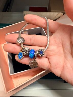 Sterling Silver Blue Charm Bracelet with Opal Glass Beads